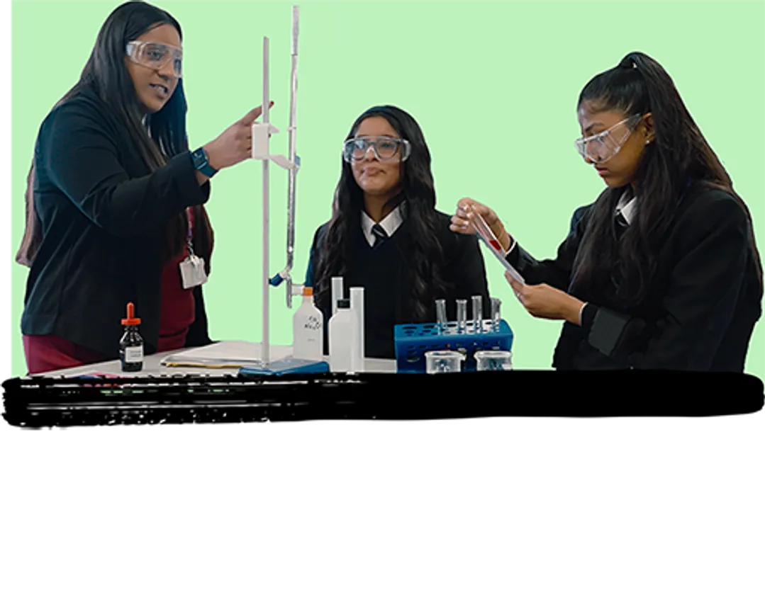 Science teacher in a practical lesson with her pupils