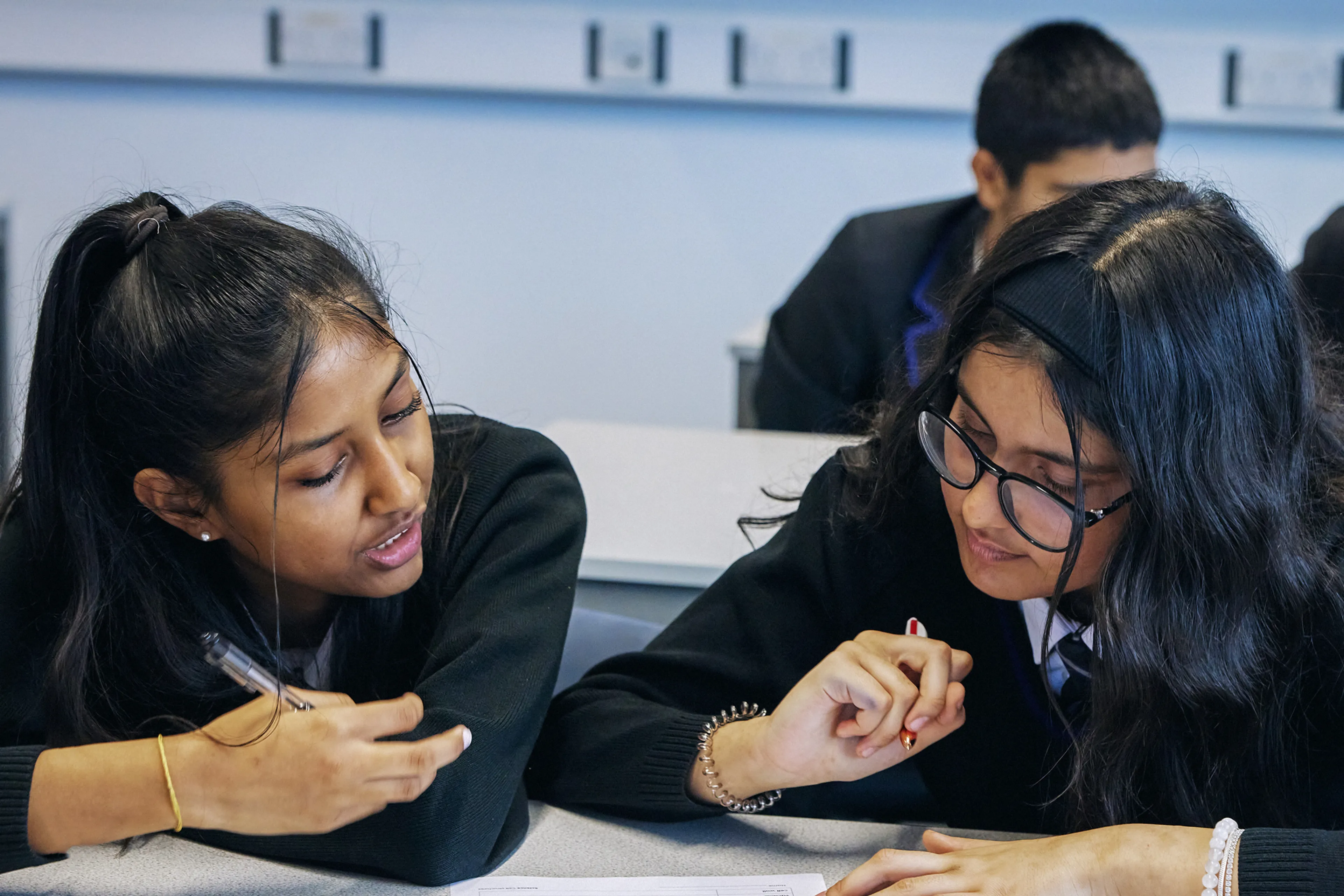 Two pupils completing a worksheet together